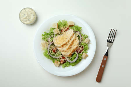 Concept of tasty eating with Caesar salad on white backgroundの写真素材