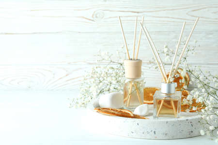 Aromatic concept with diffusers on white wooden tableの写真素材
