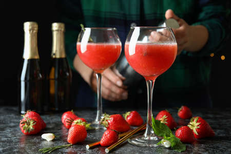 Concept of making Rossini cocktails against dark backgroundの写真素材