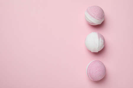 Bath balls on pink background, space for textの写真素材