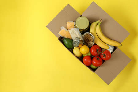 Donation box on yellow backgroundの写真素材