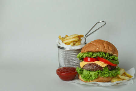 Concept of tasty food with delicious burger