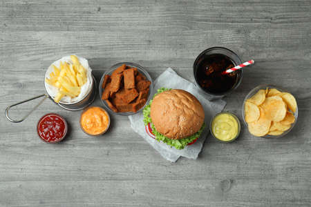 Tasty fast food on gray textured tableの写真素材