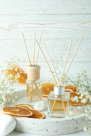 Aromatic concept with diffusers on white wooden tableの写真素材