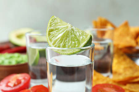 Party concept with tequila, guacamole and chipsの写真素材