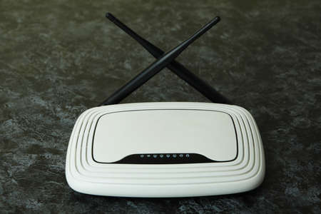 Wi-Fi router with external antennas on black smokey background
