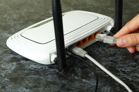 Wi - fi connection concept on black smokey table, close up