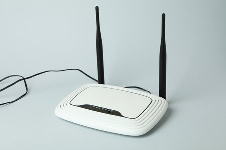 Wi-Fi router with external antennas on gray background