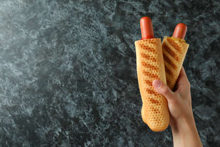 Concept of tasty food with french hot dog