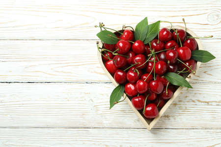 Concept of sweet berry with red cherry