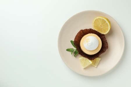 Plate with lemon cupcake on white backgroundの写真素材