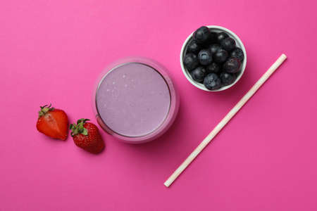 Fresh smoothie, ingredients and straw on pink backgroundの写真素材