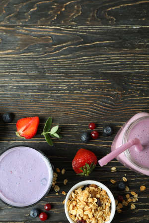Concept of breakfast with smoothie on rustic wooden tableの写真素材