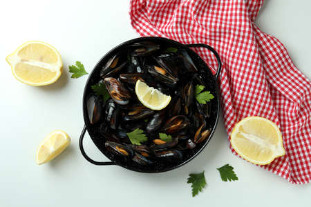 Concept of delicious food with mussels on white background