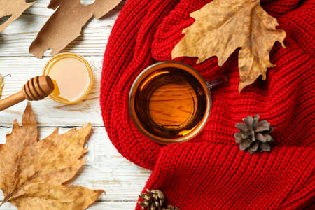 Cozy autumn concept background with tea drink