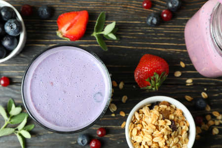 Concept of breakfast with smoothie on rustic wooden table