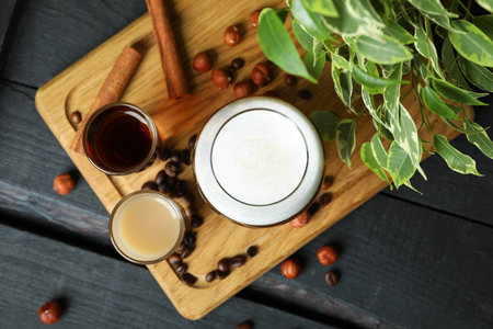 Concept of delicious drink with Irish coffee on wooden board