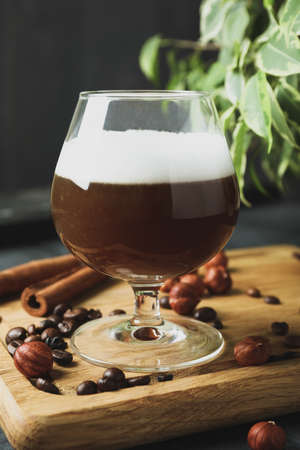 Concept of delicious drink with Irish coffee on wooden board