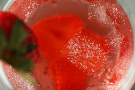 Glass of fresh strawberry cocktail with ice, macroの写真素材
