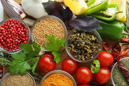 Bowls with different aromatic spices and ingredients, top view