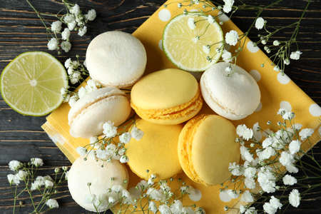 Concept of tasty dessert with macaroons on wooden backgroundの写真素材