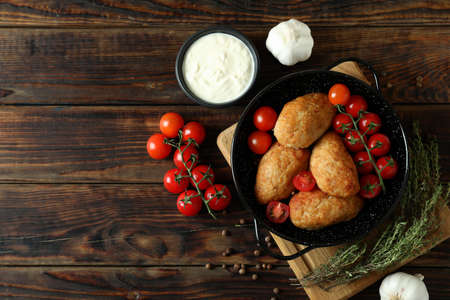 Concept of tasty food with cutlets on wooden tableの写真素材
