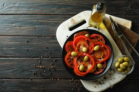 Concept of tasty food with tomato carpaccio on rustic wooden tableの写真素材