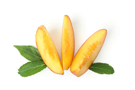 Slices of peach fruit isolated on white background