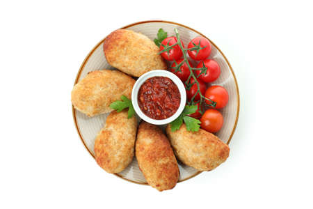 Plate with cutlets, tomatoes and sauce isolated on white background