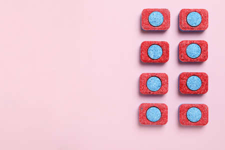 Concept of Dishwashing detergent accessories on pink background