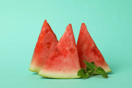 Watermelon slices and mint on mint backgroundの写真素材