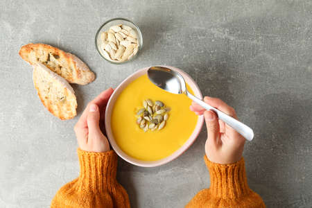 Concept of tasty eating with pumpkin soup, top viewの写真素材