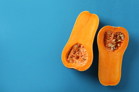 Raw pumpkins on blue background, top viewの写真素材