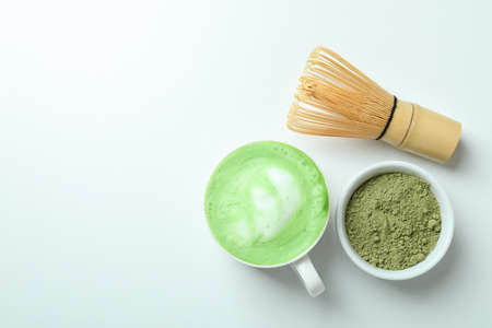 Matcha latte and accessories for making on white backgroundの写真素材