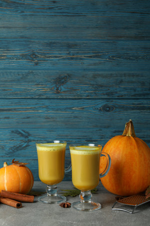 Concept of pumpkin latte against wooden backgroundの写真素材