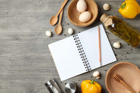 Concept of recipe on gray textured table, space for textの写真素材