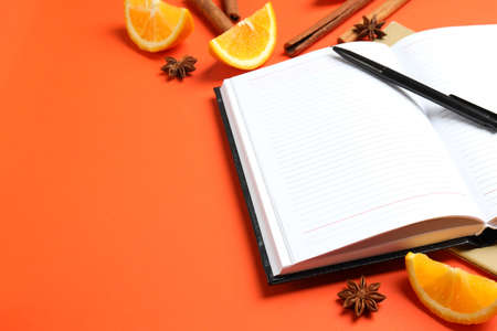 Concept of recipe book on orange background, space for textの写真素材