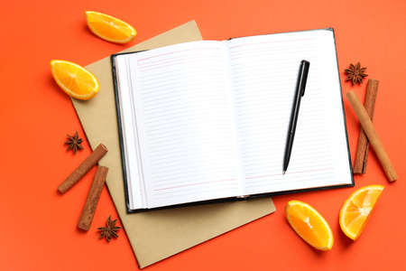 Concept of recipe book on orange background, space for textの写真素材