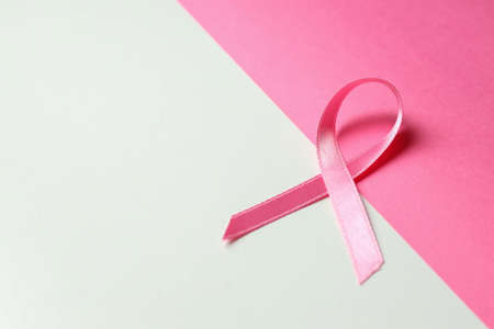 Breast cancer awareness ribbon on two tone backgroundの写真素材