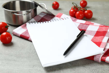 Concept of recipe on gray textured background, space for textの写真素材