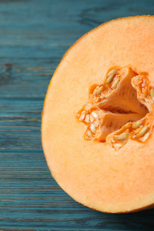 Ripe melon on wooden table, close upの写真素材