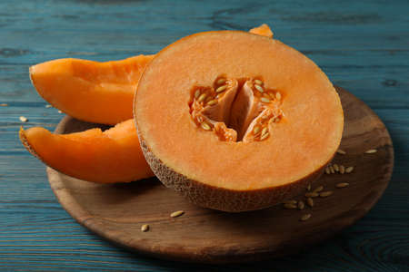 Ripe melon on wooden table, close up