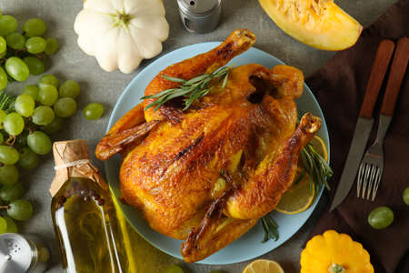 Thanksgiving Day roast turkey concept on gray textured tableの写真素材