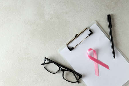 Breast cancer awareness concept on white textured tableの写真素材