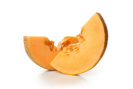 Ripe melon slices isolated on white backgroundの写真素材