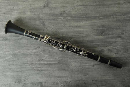 Clarinet on gray textured table, top view.の写真素材