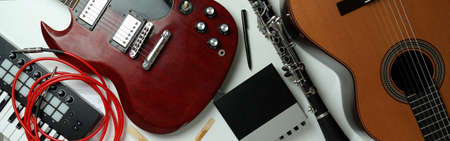 Set of different musical instruments on white background.