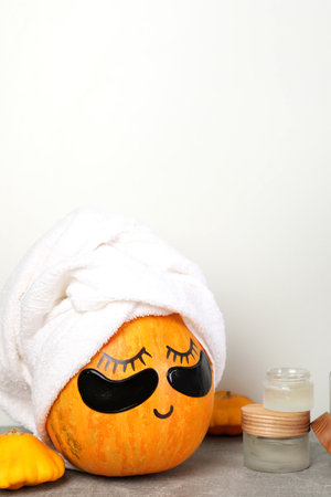 Spa concept with pumpkin on gray textured tableの写真素材