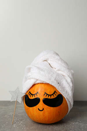 Spa concept with pumpkin on gray textured tableの写真素材