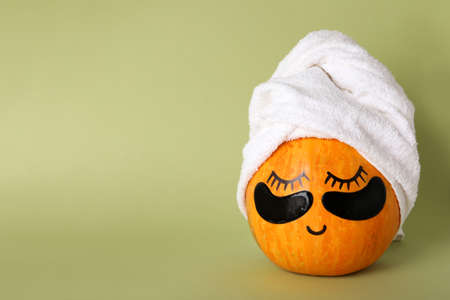 Spa concept with pumpkin on green backgroundの写真素材